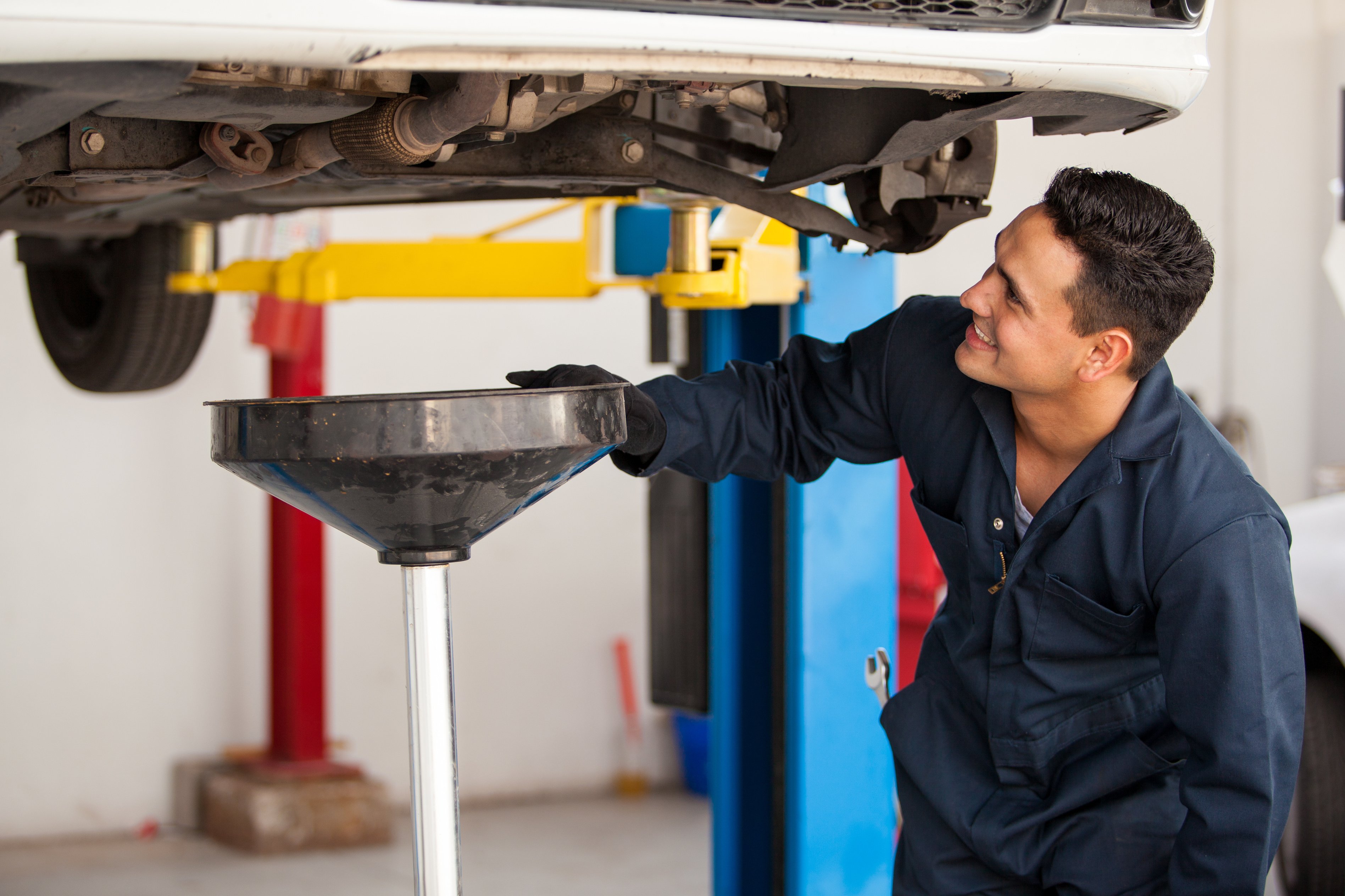 Performing an oil change on a car